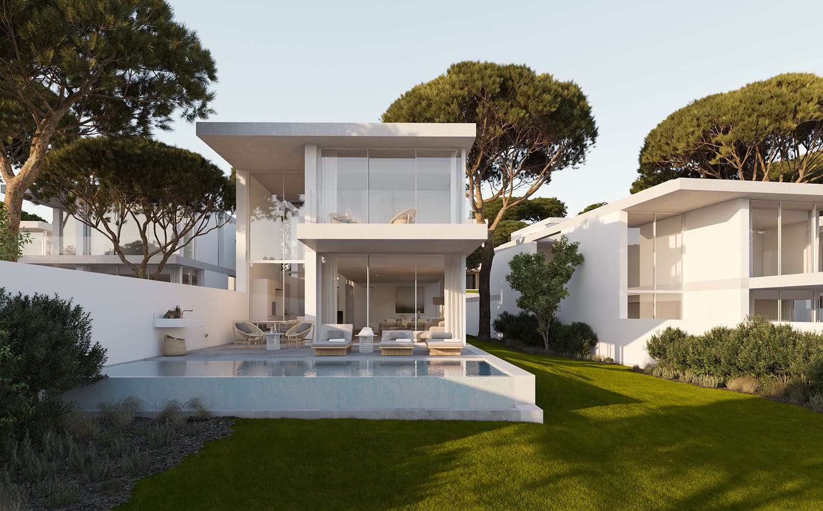 Vista exterior con piscina de una de las casas con ventanas minimalistas situadas en PGA Catalunya | Alumilux